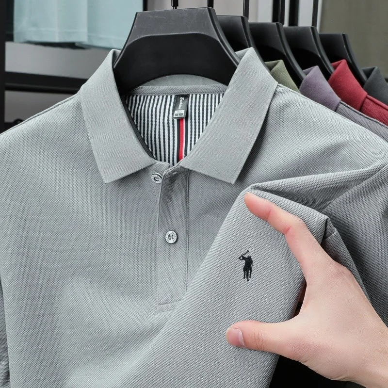 Men's casual cotton summer polo shirt, featuring a buttoned collar and a embroidered pattern on the chest.
Men's casual cotton summer polo shirt, featuring a buttoned collar and a embroidered pattern on the chest.