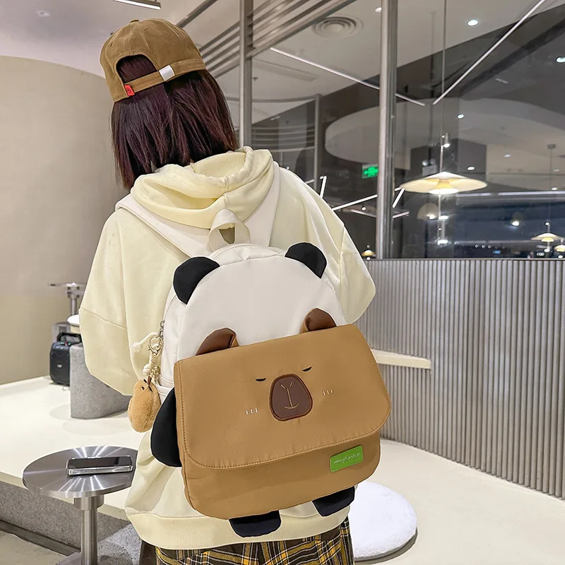 2025 Новая модная студенческая сумка большой вместимости, универсальная дорожная сумка с пандой для девочек, персонализированный рюкзак
2025 Новая модная студенческая сумка большой вместимости, универсальная дорожная сумка с пандой для девочек, персонализированный рюкзак