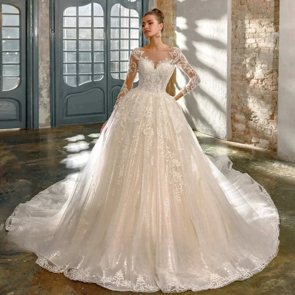 Sparkling Wedding Dresses 2026 Sheer Neck Lace Applique Beaded Long Sleeves Sequins Bead Illusion Princess Bridal Gowns
Sparkling Wedding Dresses 2026 Sheer Neck Lace Applique Beaded Long Sleeves Sequins Bead Illusion Princess Bridal Gowns