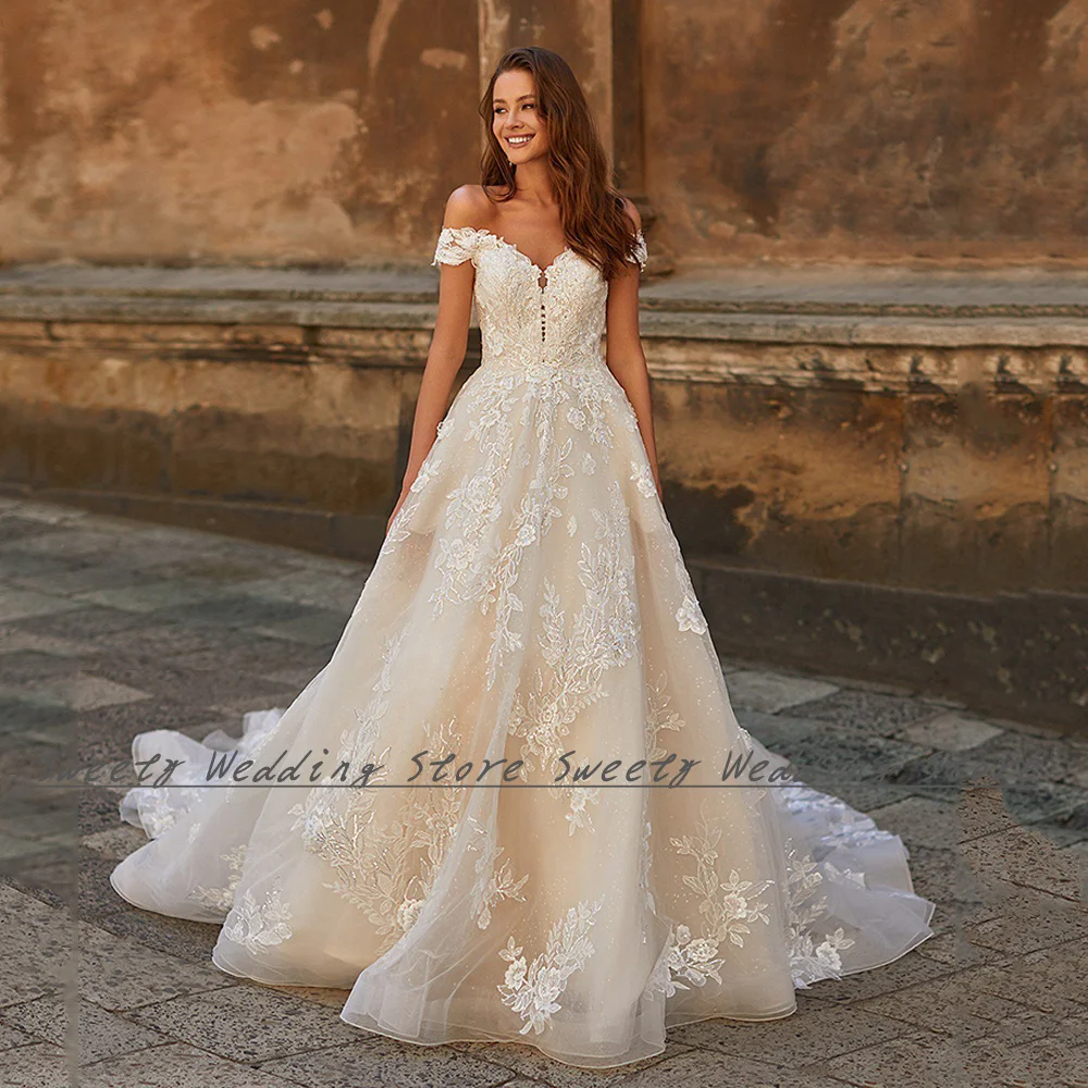 Romantic A Line Wedding Dress Glitter Bridal Gown Off The Shoulder Beading Applique Zipper Buttons Court Train Bride Dresses
Romantic A Line Wedding Dress Glitter Bridal Gown Off The Shoulder Beading Applique Zipper Buttons Court Train Bride Dresses