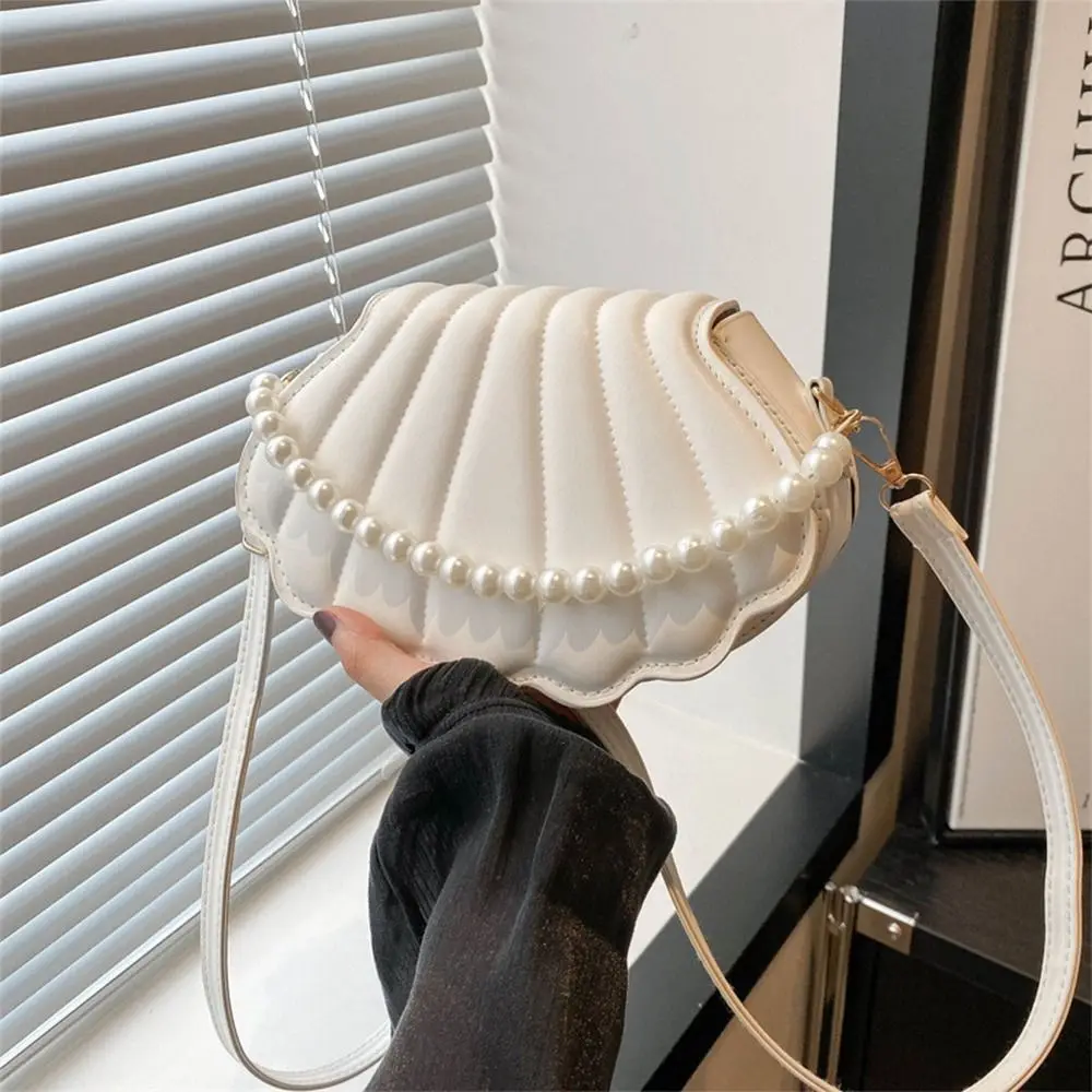 Stylish Cute Shell Shoulder Bag with Pearls Design Minimalist Crossbody Bag PU Leather Pearl Decorated Handbag for Women Girls
Stylish Cute Shell Shoulder Bag with Pearls Design Minimalist Crossbody Bag PU Leather Pearl Decorated Handbag for Women Girls