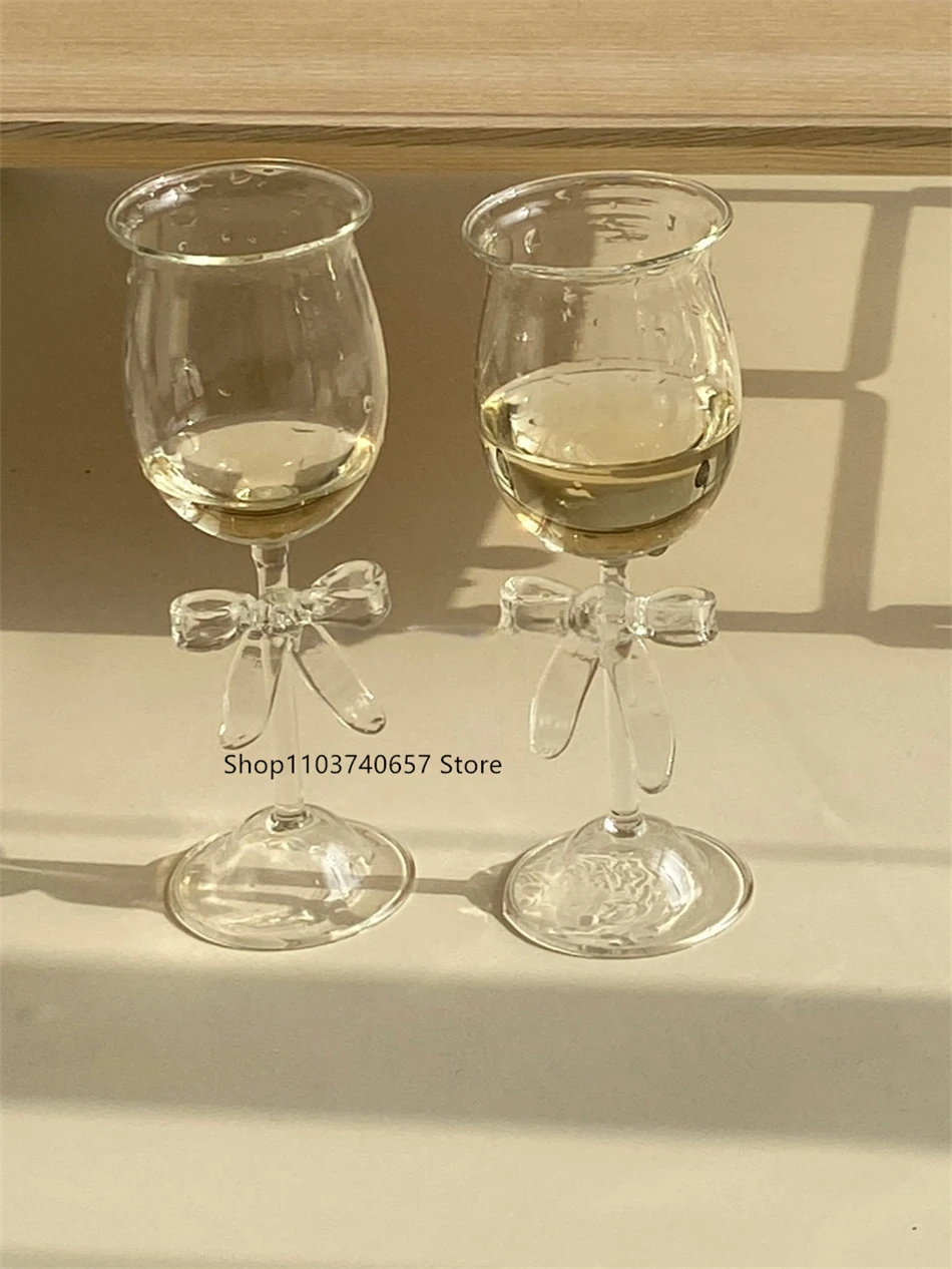 Transparent Creative Bow Champagne Glass Ins Korean-style Glass Goblet Household Shaped Red Wine Glass Cup
Transparent Creative Bow Champagne Glass Ins Korean-style Glass Goblet Household Shaped Red Wine Glass Cup