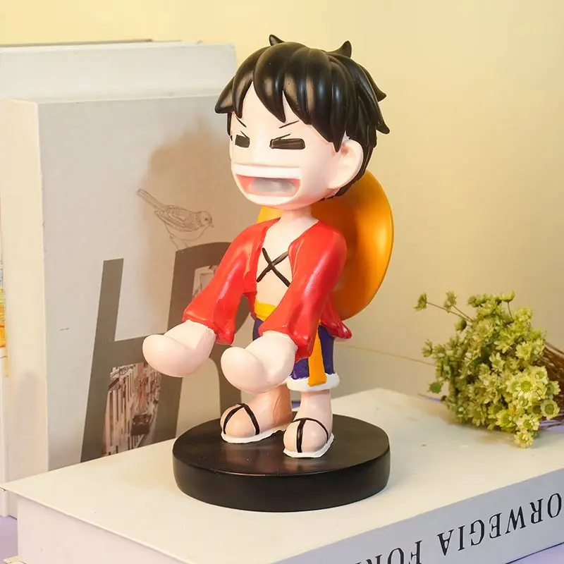 New Q version One Piece anime Luffy mobile phone stand creative Luffy peripheral bedroom home decoration desktop ornaments gift
New Q version One Piece anime Luffy mobile phone stand creative Luffy peripheral bedroom home decoration desktop ornaments gift