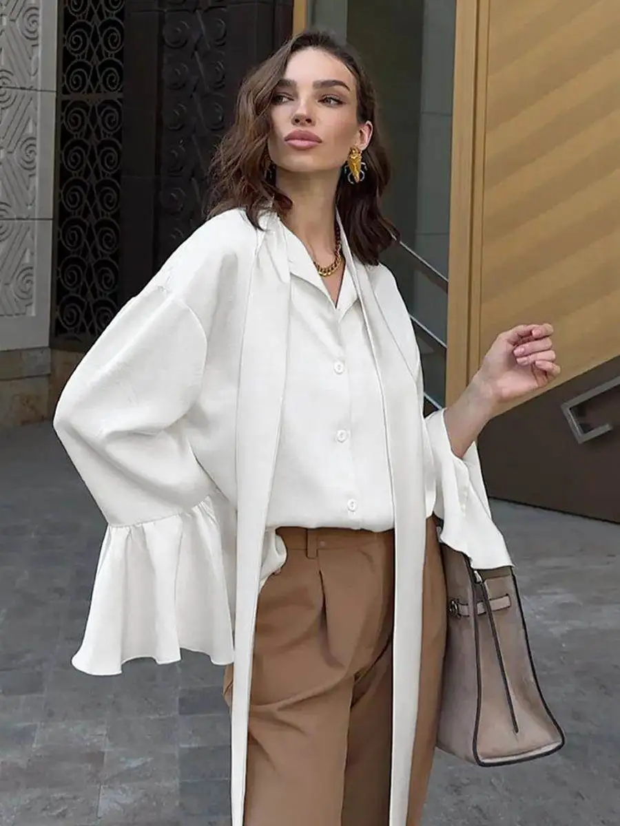 Европейский и американский атласный топ с рюшами, женская мода 2025 года, весенняя рубашка в дворцовом стиле с бежевой лентой, женская одежда средней длины
Европейский и американский атласный топ с рюшами, женская мода 2025 года, весенняя рубашка в дворцовом стиле с бежевой лентой, женская одежда средней длины