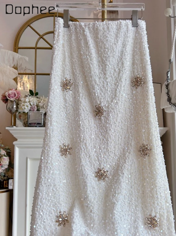 Юбка-русалка с тяжелыми пайетками, женская осенне-зимняя новая модная утягивающая юбка трапециевидной формы с высокой талией, элегантные светские юбки средней длины
Юбка-русалка с тяжелыми пайетками, женская осенне-зимняя новая модная утягивающая юбка трапециевидной формы с высокой талией, элегантные светские юбки средней длины