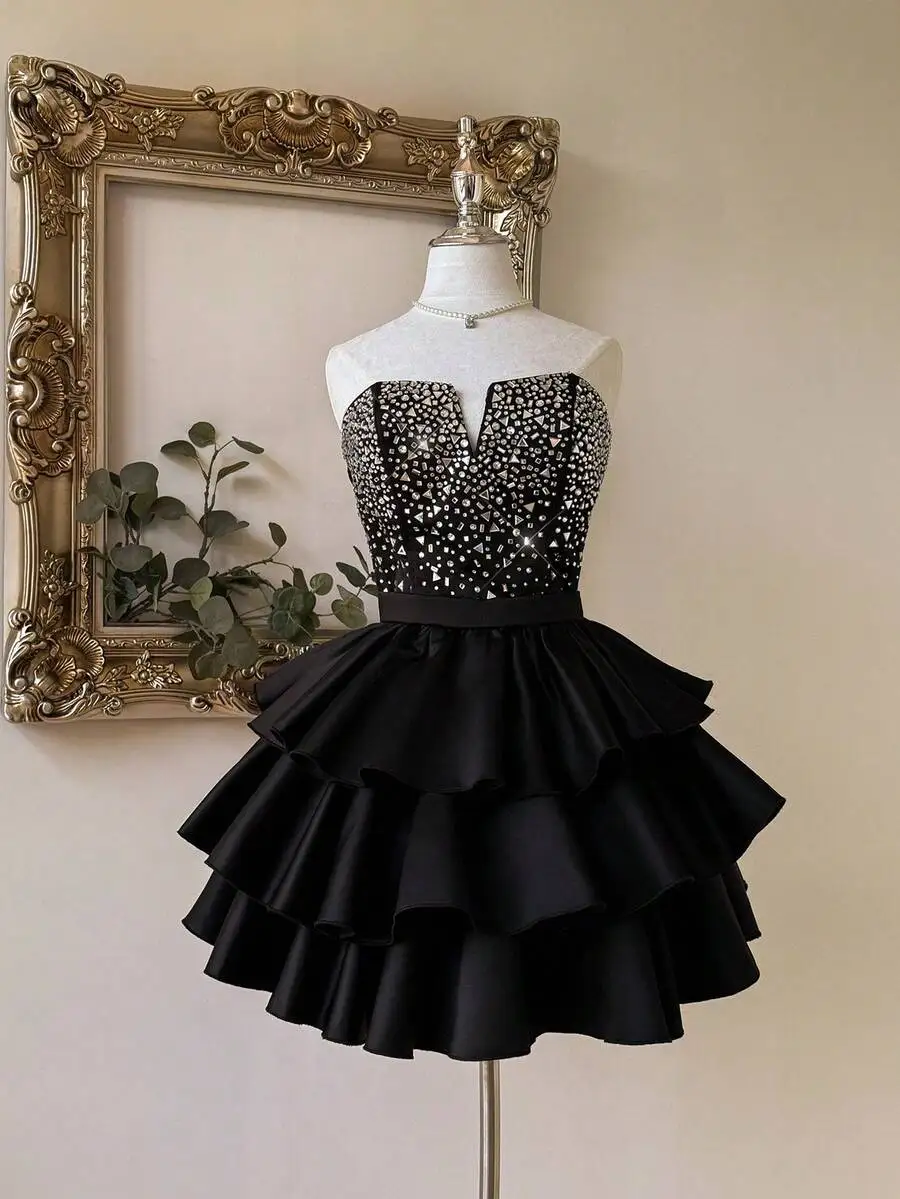 Black Satin Mini Dress with Rhinestone Bustier and Tiered Ruffle Skirt
Black Satin Mini Dress with Rhinestone Bustier and Tiered Ruffle Skirt