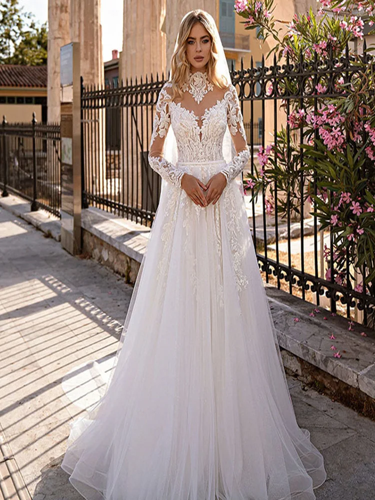 Garden Long Sleeves Tulle Wedding Dress Princess Lace Appliques V-Neck Illusion Backless With Button Bridal Gown Custom Made
Garden Long Sleeves Tulle Wedding Dress Princess Lace Appliques V-Neck Illusion Backless With Button Bridal Gown Custom Made