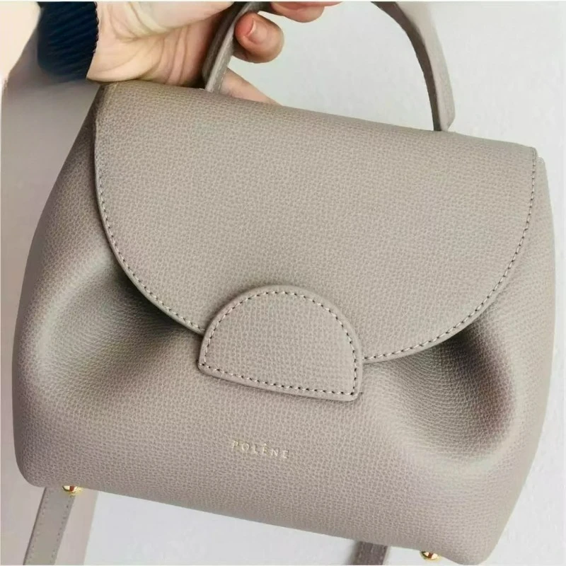 Unique French design handbag lychee pattern color block pig face smile handbag size soft polyester lining
Unique French design handbag lychee pattern color block pig face smile handbag size soft polyester lining