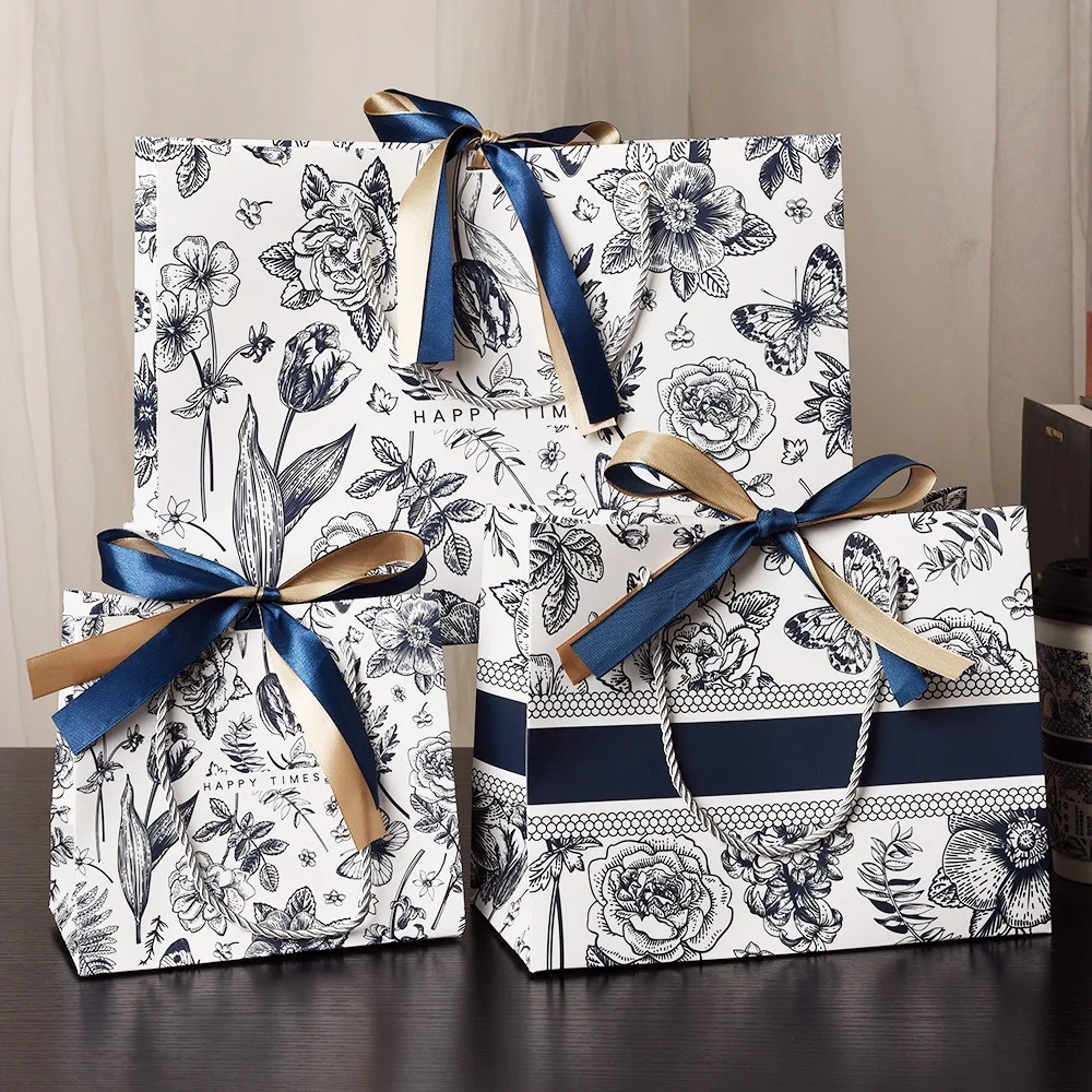 Floral Gift Packaging Bags Paper with Bow Ribbon Tote Bag Handbag Flower Pattern Candy Snacks Packing Bag
Floral Gift Packaging Bags Paper with Bow Ribbon Tote Bag Handbag Flower Pattern Candy Snacks Packing Bag