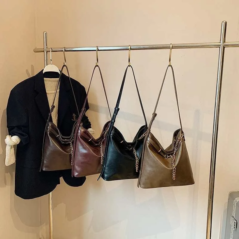 Ретро-сумка через плечо, большая вместимость, высококачественная сумка подмышками, модная и простая сумка-ведро, универсальная диагональная сумка через плечо.
Ретро-сумка через плечо, большая вместимость, высококачественная сумка подмышками, модная и простая сумка-ведро, универсальная диагональная сумка через плечо.