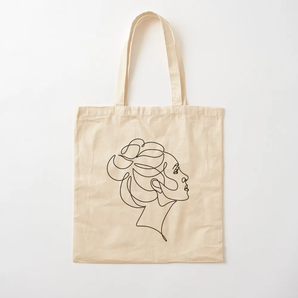 Woman face one line art. Line drawing. Line girl. One face. Fashion print. Salon beauty print. Beautiful girl. Minimali Tote Bag
Woman face one line art. Line drawing. Line girl. One face. Fashion print. Salon beauty print. Beautiful girl. Minimali Tote Bag