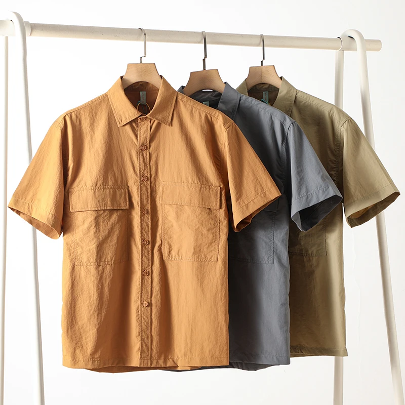 Men's Japanese-Style Minimalist Short-Sleeve Work Shirt – Loose Fit, Solid Color, Breathable Polyester Casual & Outdoor Wear
Men's Japanese-Style Minimalist Short-Sleeve Work Shirt – Loose Fit, Solid Color, Breathable Polyester Casual & Outdoor Wear