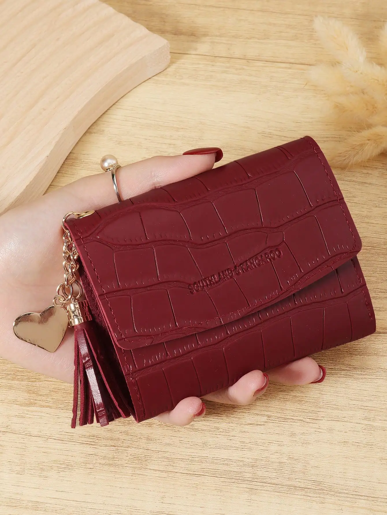 This Fashionable Tri-Fold Women's Short Wallet Features Wine Red Crocodile-Embossed Leather With Heart-Shaped Metal Hardware. Crafted With Quality Leather, It Has Multiple Card Slots To Hold Credit Cards And Coins. The Compact Design Makes It Convenient F
This Fashionable Tri-Fold Women's Short Wallet Features Wine Red Crocodile-Embossed Leather With Heart-Shaped Metal Hardware. Crafted With Quality Leather, It Has Multiple Card Slots To Hold Credit Cards And Coins. The Compact Design Makes It Convenient F