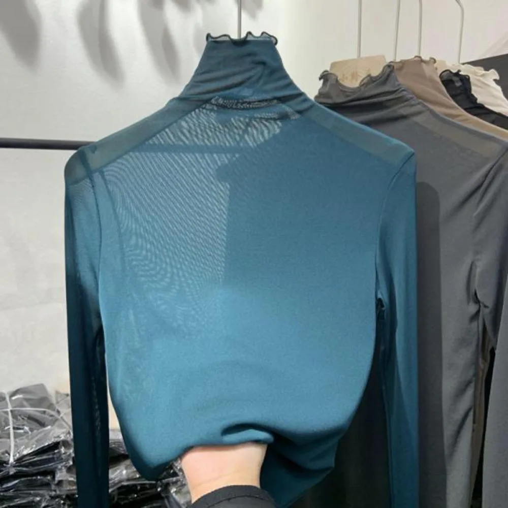 European Spring New Mesh Lace Women's High Neck Long Sleeve Solid Color Underwear Western Style Slim Fit Top
European Spring New Mesh Lace Women's High Neck Long Sleeve Solid Color Underwear Western Style Slim Fit Top