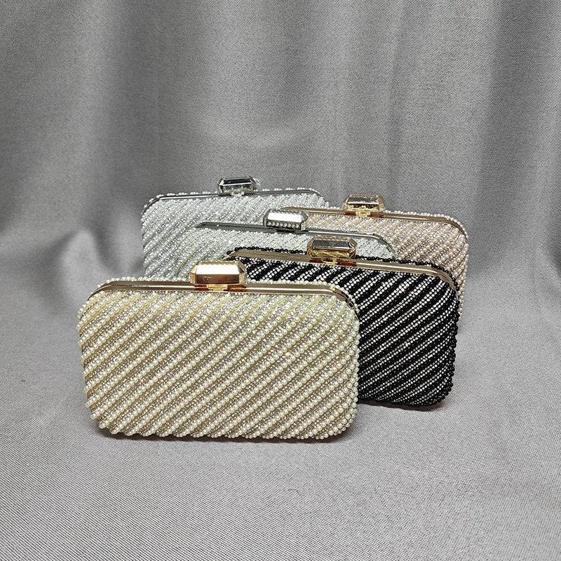 Women Pearl & Rhinestone Clutch Collection Shine Bright Elegant Striped Pearl Clutches
Women Pearl & Rhinestone Clutch Collection Shine Bright Elegant Striped Pearl Clutches