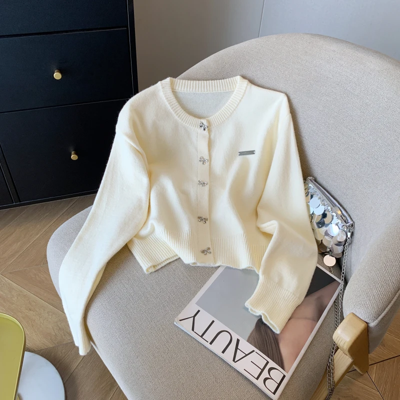 Korean Chic Bow Button Knitted Cardigan for Women Autumn Winter Fashion Temperament Solid Round Neck Soft Sweater Female Tops
Korean Chic Bow Button Knitted Cardigan for Women Autumn Winter Fashion Temperament Solid Round Neck Soft Sweater Female Tops