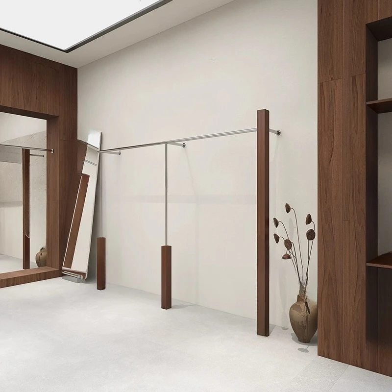 Display racks on the wall, walnut women's clothing store, floor to ceiling hangers on shelves, stainless steel display racks
Display racks on the wall, walnut women's clothing store, floor to ceiling hangers on shelves, stainless steel display racks