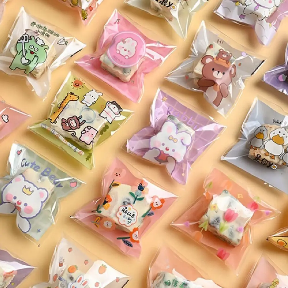 100Pcs DIY Cookies Packaging Bag Cute Transparent Cartoon Candy Wrapping Pouch Snack Bags Sealed Packaging Bags
100Pcs DIY Cookies Packaging Bag Cute Transparent Cartoon Candy Wrapping Pouch Snack Bags Sealed Packaging Bags