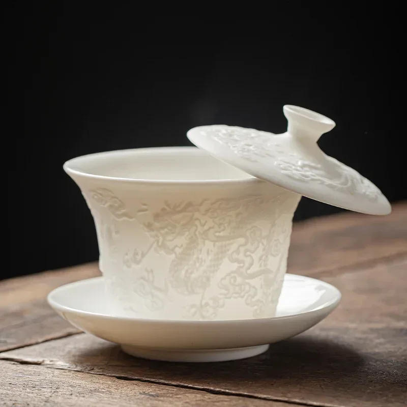 Embossed suet jade Sancai cover bowl teacup hovering high-grade white ceramic set tea making kung fu tea set
Embossed suet jade Sancai cover bowl teacup hovering high-grade white ceramic set tea making kung fu tea set
