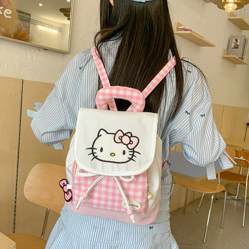 Милый персонаж мультфильма Hello Kitty розовый клетчатый рюкзак мини-рюкзак Kawaii повседневная универсальная сумка для покупок оптовая продажа праздничный подарок 
Милый персонаж мультфильма Hello Kitty розовый клетчатый рюкзак мини-рюкзак Kawaii повседневная универсальная сумка для покупок оптовая продажа праздничный подарок