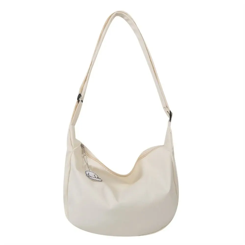 Korean Style Lightweight Shoulder Bag Large Capacity Cream Color Canvas Bag with Pendant Solid Color Handbag Simple Dumpling Bag
Korean Style Lightweight Shoulder Bag Large Capacity Cream Color Canvas Bag with Pendant Solid Color Handbag Simple Dumpling Bag