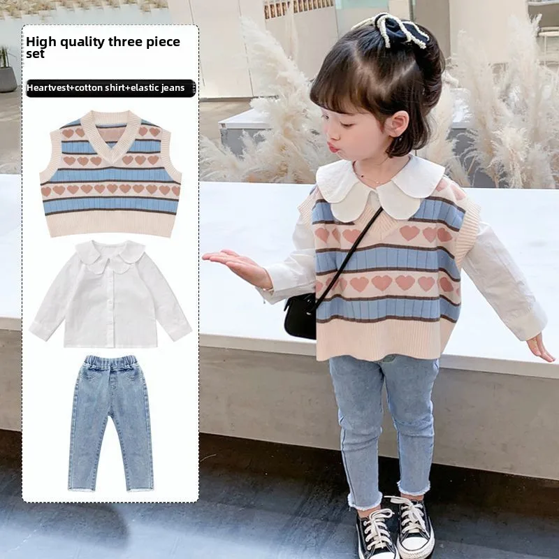 Knitted striped waistcoat girls suit autumn new Korean style baby doll collar shirt in small children three-piece set
Knitted striped waistcoat girls suit autumn new Korean style baby doll collar shirt in small children three-piece set