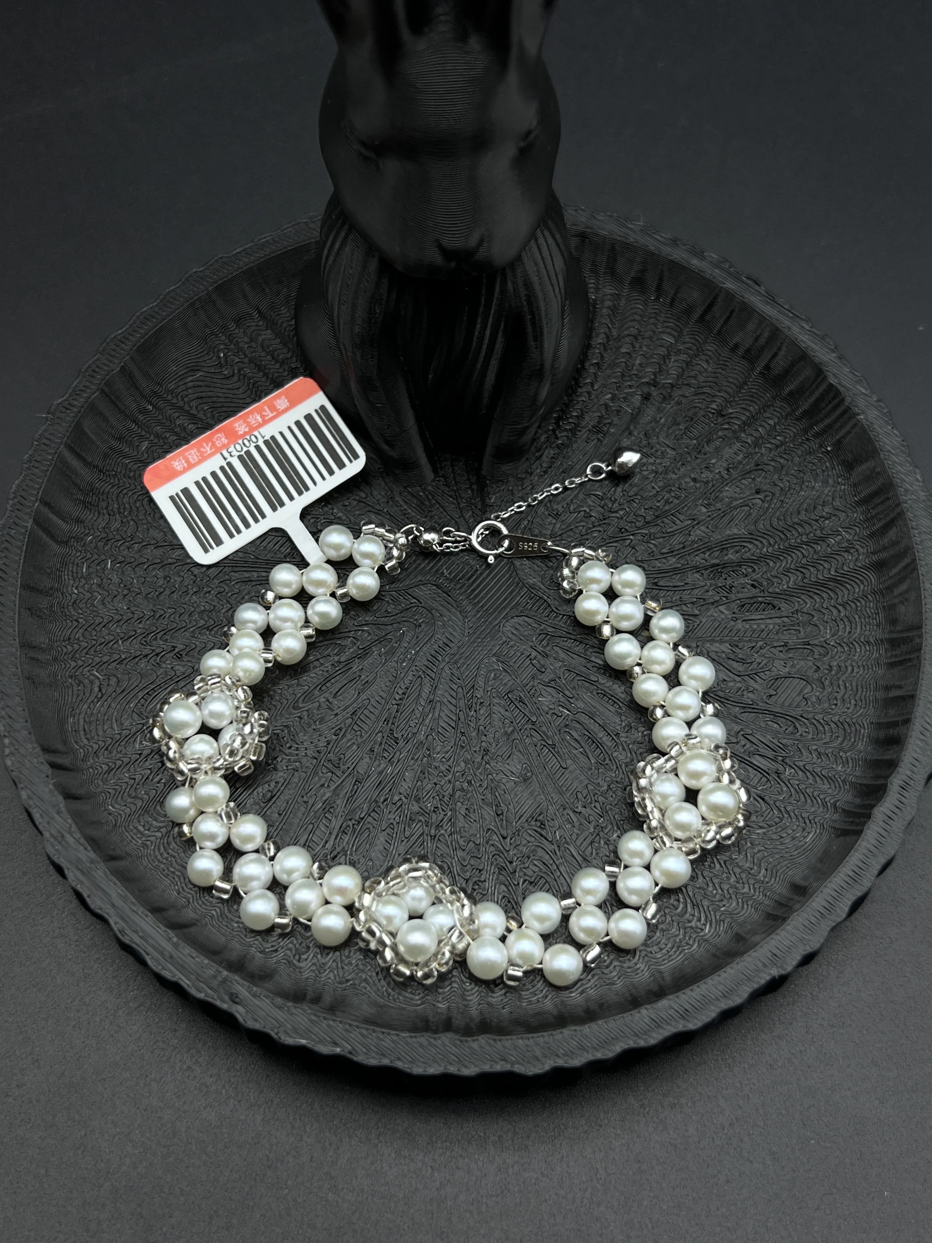 Adjustable Freshwater Pearl Bracelet with Handwoven Silver Wire Flower Accents
Adjustable Freshwater Pearl Bracelet with Handwoven Silver Wire Flower Accents