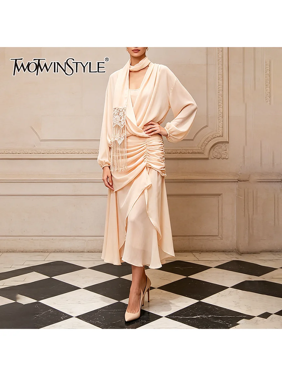 TWOTWINSTYLE Folds Two Piece Sets for Women O Neck Long Sleeve Spliced Tassel Scarf Shirt High Waist Skirt Solid Set Female 2026
TWOTWINSTYLE Folds Two Piece Sets for Women O Neck Long Sleeve Spliced Tassel Scarf Shirt High Waist Skirt Solid Set Female 2026