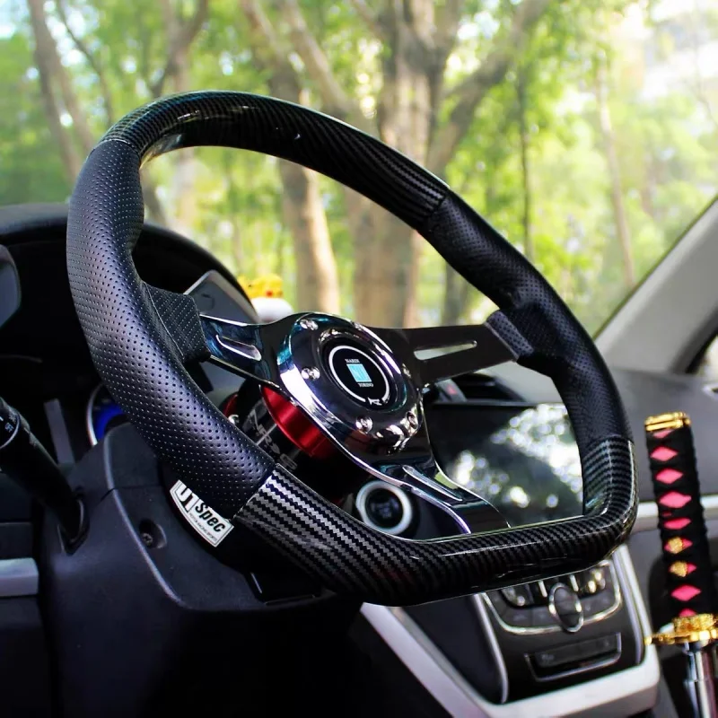 14-inch 350mm D-shaped semi-circular carbon fibre wrapped steering wheel with polished chrome spokes and black leather
14-inch 350mm D-shaped semi-circular carbon fibre wrapped steering wheel with polished chrome spokes and black leather