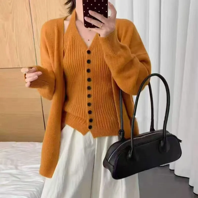 Fashion Korean Lazy Knitted Cardigan Jacket Neck Sling Vest Two-piece Set Autumn and Winter High-end Soft Waxy Sweater Set
Fashion Korean Lazy Knitted Cardigan Jacket Neck Sling Vest Two-piece Set Autumn and Winter High-end Soft Waxy Sweater Set