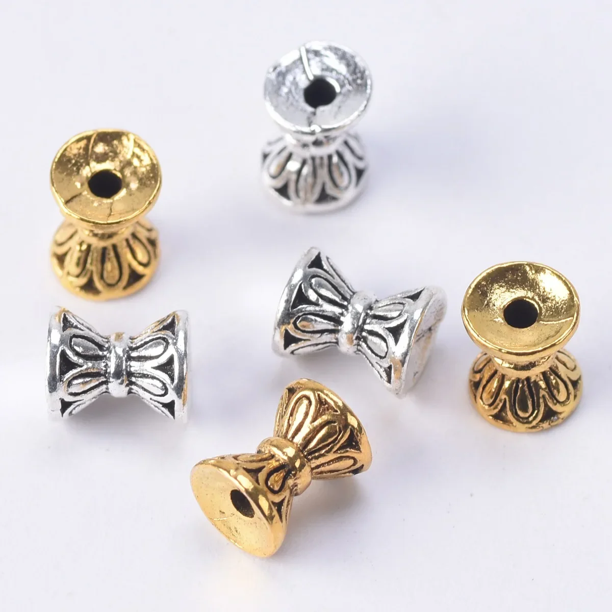 Hourglass Shape Antique Gold Color Tibetan Silver 6.5x5.5mm Loose Metal Spacer Beads Lot for Jewelry Making DIY Crafts Findings
Hourglass Shape Antique Gold Color Tibetan Silver 6.5x5.5mm Loose Metal Spacer Beads Lot for Jewelry Making DIY Crafts Findings