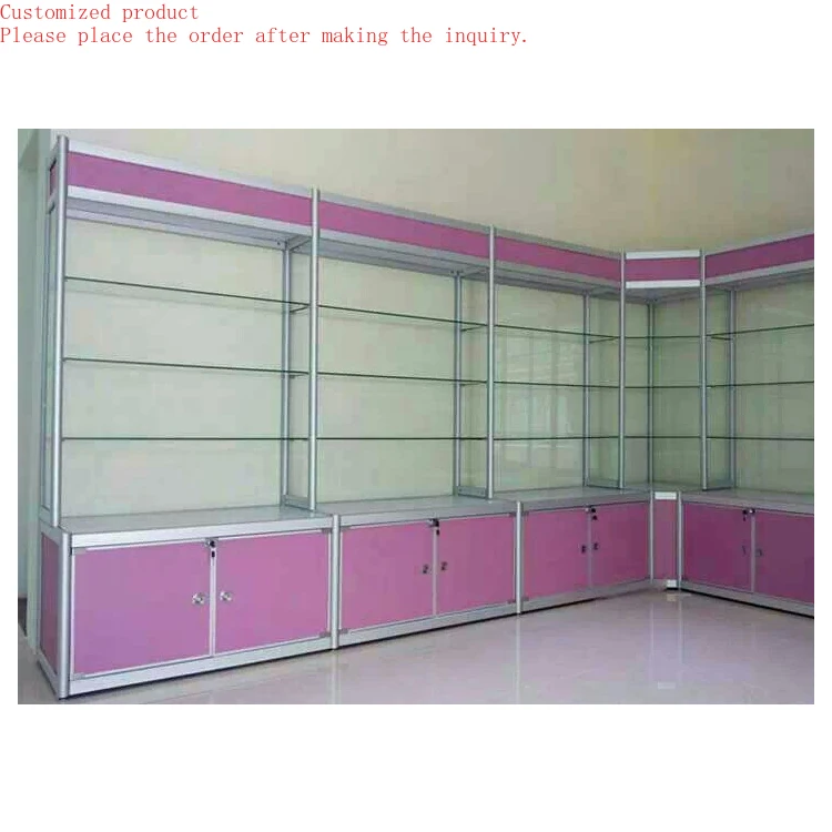 Custom.Aluminum Frame Silver pink Color Glass and MDF Corner showcase Design with Storage Cabinet
Custom.Aluminum Frame Silver pink Color Glass and MDF Corner showcase Design with Storage Cabinet