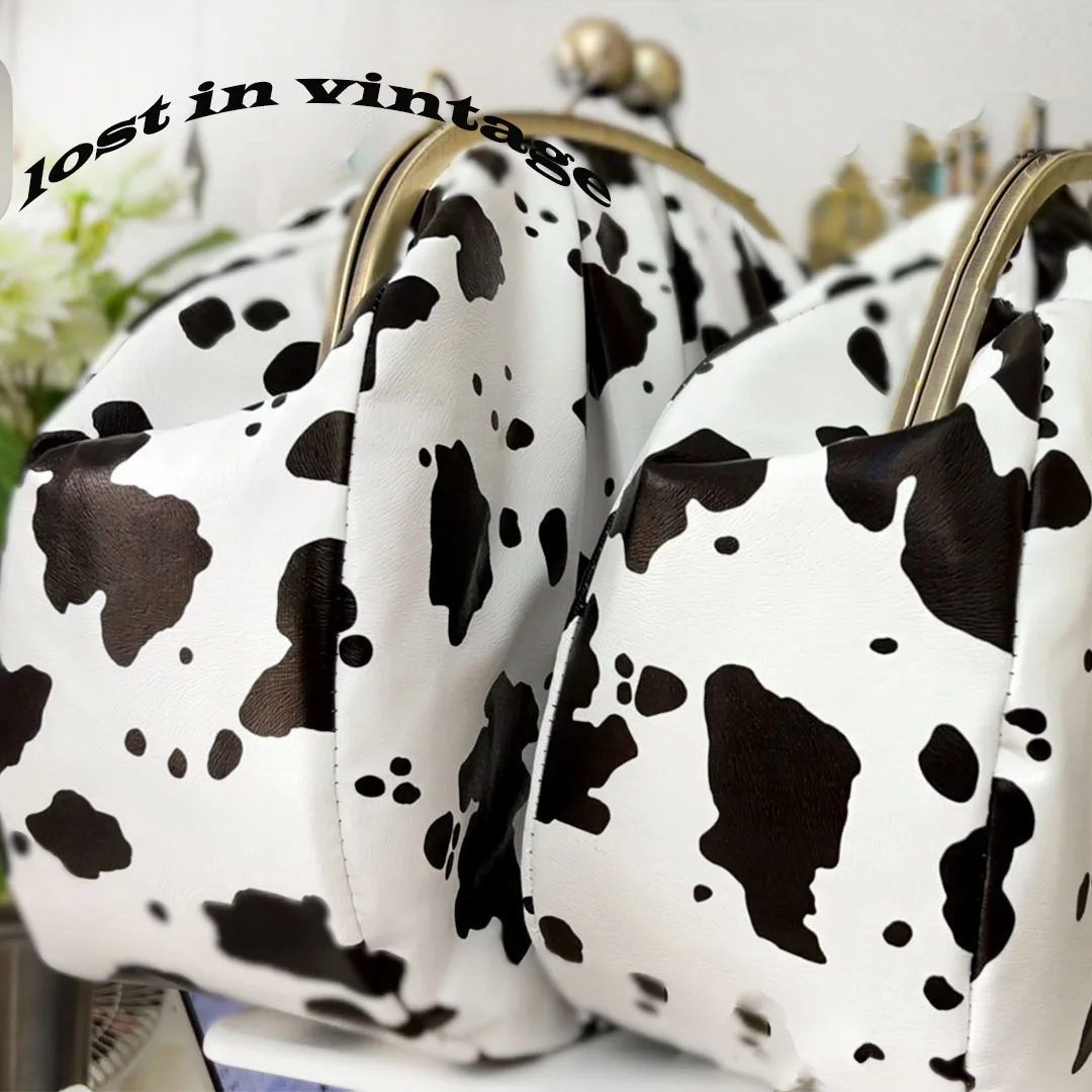LOST IN VINTAGE Artficial Leather Cow Pattern Fabric Clutch Metal Frame Kiss Lock and Metal Handle Puffy Purse 34x23x11cm Cow
LOST IN VINTAGE Artficial Leather Cow Pattern Fabric Clutch Metal Frame Kiss Lock and Metal Handle Puffy Purse 34x23x11cm Cow