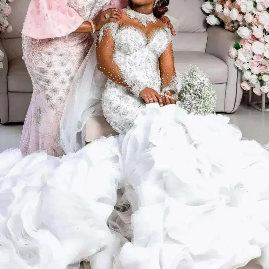 Customized Sparkly Sequined Crystals Beaded Illusion Long Sleeves High Collar Plus Size African Bride Ruffles Mermaid Wedding Dr
Customized Sparkly Sequined Crystals Beaded Illusion Long Sleeves High Collar Plus Size African Bride Ruffles Mermaid Wedding Dr