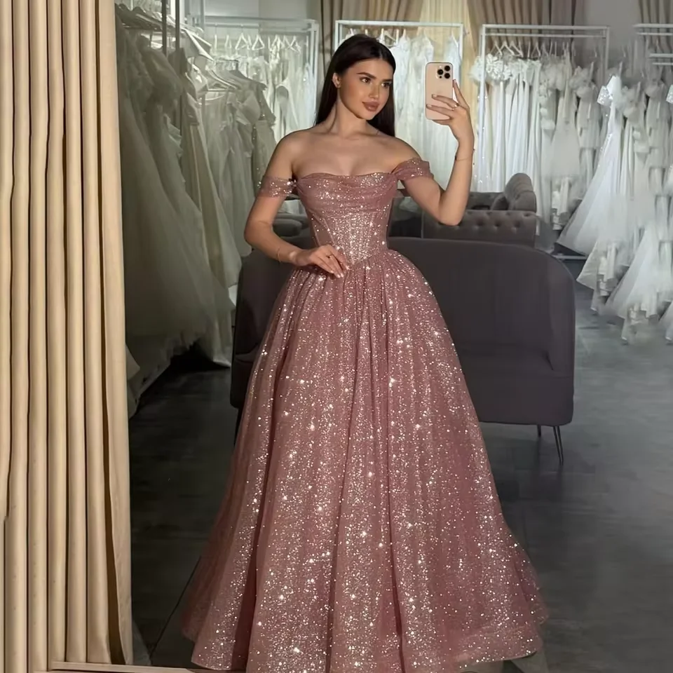 Customized Moden Prom Dress 2026 Glitter Tulle Off the Shoulder Wedding Party Dress Boat-neck A-line Floor-Length Evening Gowns
Customized Moden Prom Dress 2026 Glitter Tulle Off the Shoulder Wedding Party Dress Boat-neck A-line Floor-Length Evening Gowns