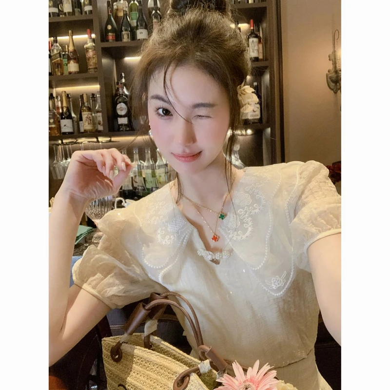 Французская нежная кружевная блузка с рюшами и воротником, женская летняя мода 2025 года, облегающая рубашка с короткими рукавами, элегантные универсальные топы
Французская нежная кружевная блузка с рюшами и воротником, женская летняя мода 2025 года, облегающая рубашка с короткими рукавами, элегантные универсальные топы