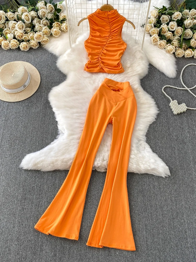 Minimalist style semi high neck knitted elastic pleated short vest+slim fit flared pants solid color fashion two piece set
Minimalist style semi high neck knitted elastic pleated short vest+slim fit flared pants solid color fashion two piece set