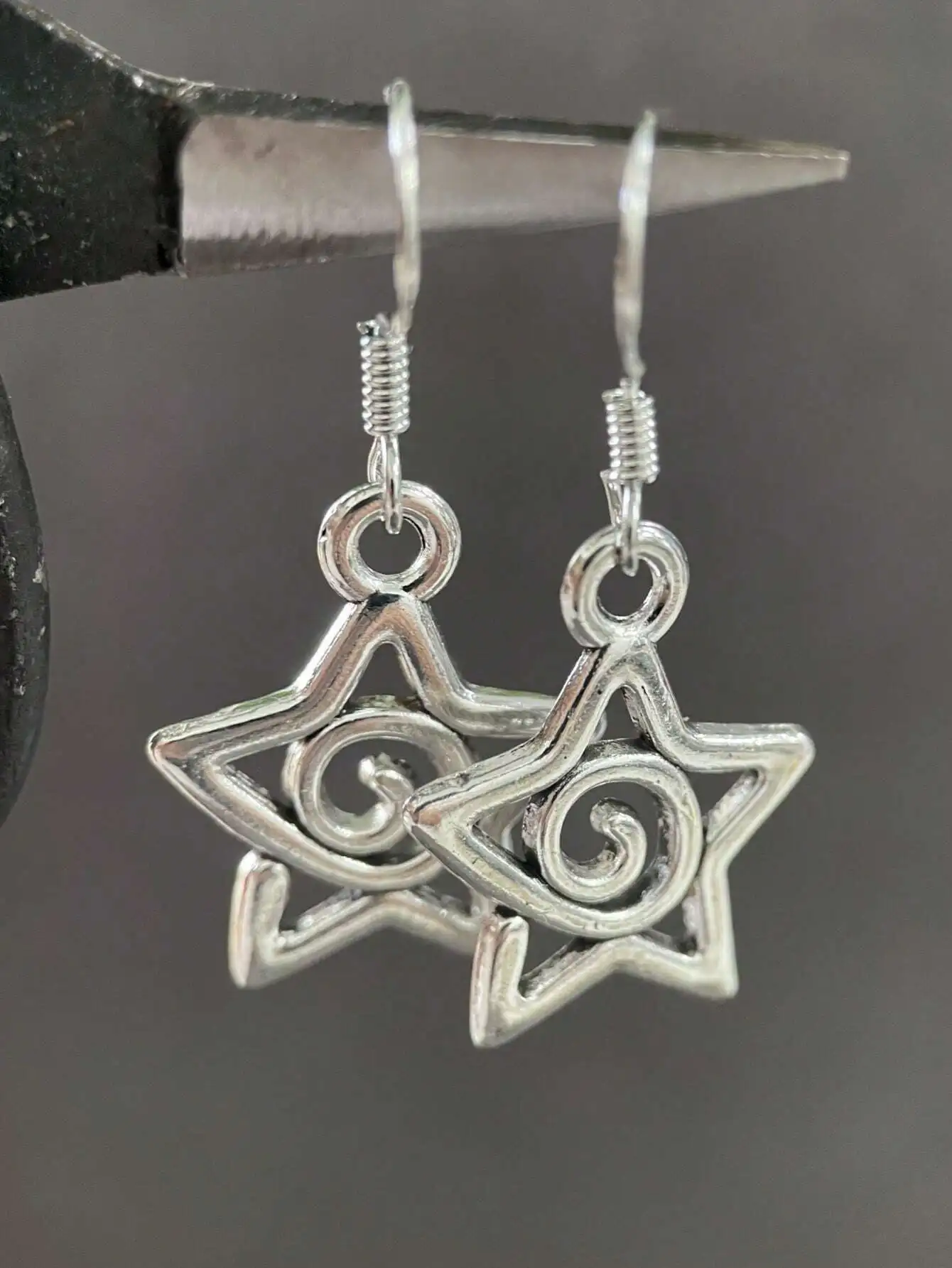 Handmade Silver-Tone Star Drop Earrings with Swirl Detail for Women
Handmade Silver-Tone Star Drop Earrings with Swirl Detail for Women