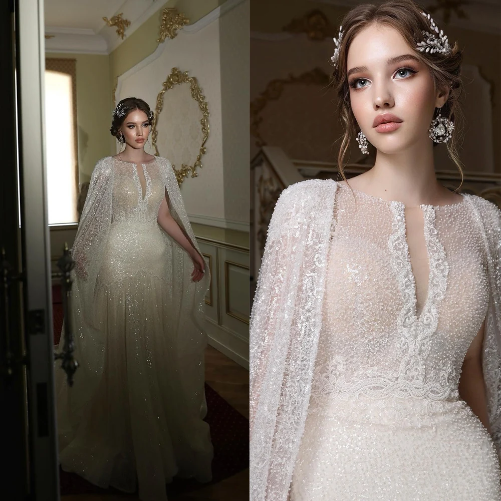 Generous Customized Wedding Dress Square Neckline with Crystal Beading Bridal Gowns Sheer Cape Sleeves & Sparkling A Line Skirt
Generous Customized Wedding Dress Square Neckline with Crystal Beading Bridal Gowns Sheer Cape Sleeves & Sparkling A Line Skirt