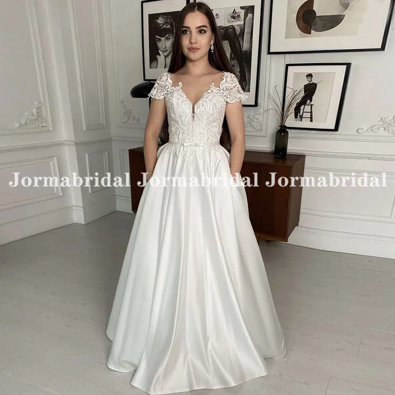 Vintage Appliqued Cap Sleeve Wedding Dresses with Pocket A-line Satin Bride Dresses for Women 2022 Floor Length robes de soirée
Vintage Appliqued Cap Sleeve Wedding Dresses with Pocket A-line Satin Bride Dresses for Women 2022 Floor Length robes de soirée