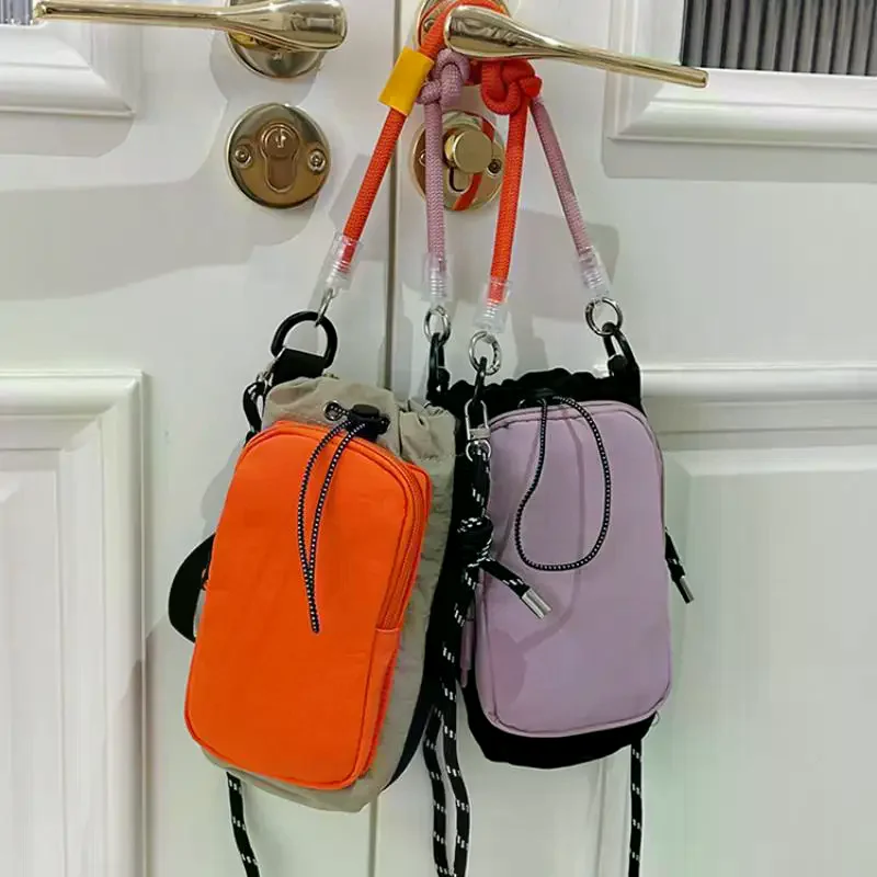 Drawstring Mini Crossbody Bag Color Block Sports Nylon Drawstring Crossbody Bag For Sports And Travel Outdoor Small Phone Bag
Drawstring Mini Crossbody Bag Color Block Sports Nylon Drawstring Crossbody Bag For Sports And Travel Outdoor Small Phone Bag