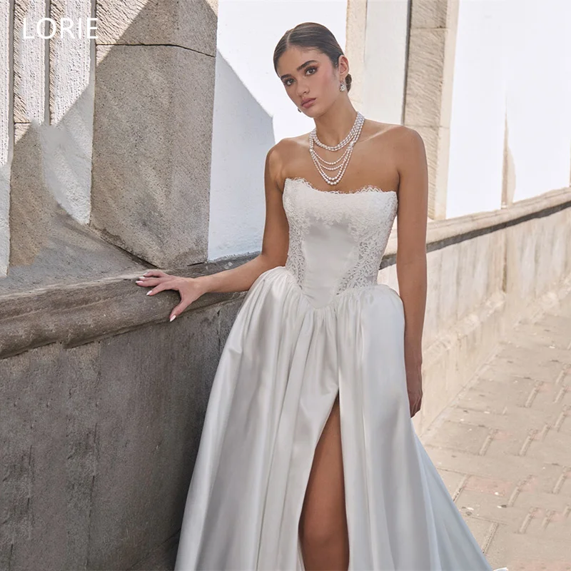 LORIE A-Line Appliques Satin Wedding Dresses Strapless Pleat Bride Prom Gown Side Silt Floor-Length Elegent Bridal Gown Custom
LORIE A-Line Appliques Satin Wedding Dresses Strapless Pleat Bride Prom Gown Side Silt Floor-Length Elegent Bridal Gown Custom