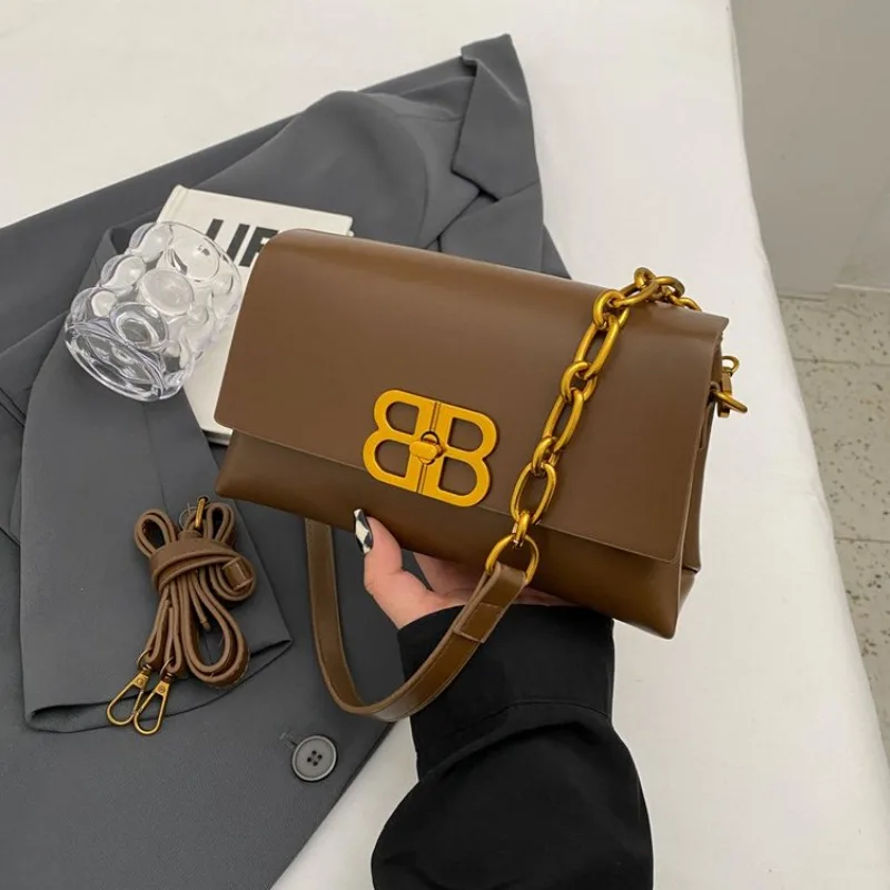 Парижская дизайнерская сумка для подгузников, роскошная кожаная сумка-шоппер однотонного цвета для женщин, модная классическая модель
Парижская дизайнерская сумка для подгузников, роскошная кожаная сумка-шоппер однотонного цвета для женщин, модная классическая модель