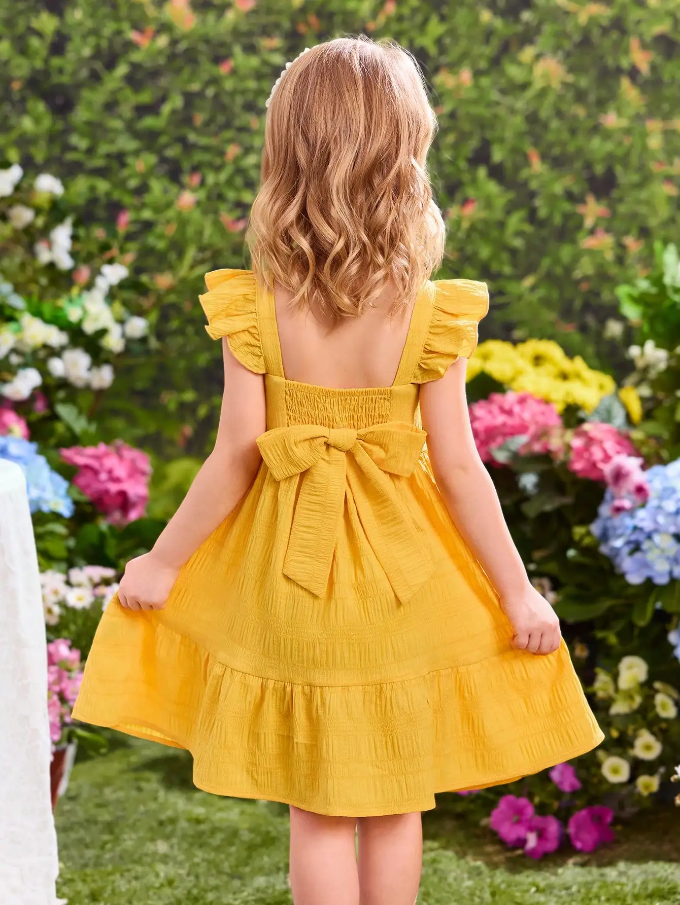 Желтое многоярусное платье с рюшами, короткими рукавами и бантом на спине для девочек
Желтое многоярусное платье с рюшами, короткими рукавами и бантом на спине для девочек