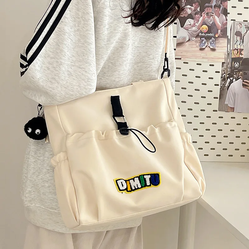 Japanese Crossbody Handbgas Drawstring Design Ins Simple Crossbody Bag Female College Student Class Bag Large Capacity Tote Bag
Japanese Crossbody Handbgas Drawstring Design Ins Simple Crossbody Bag Female College Student Class Bag Large Capacity Tote Bag