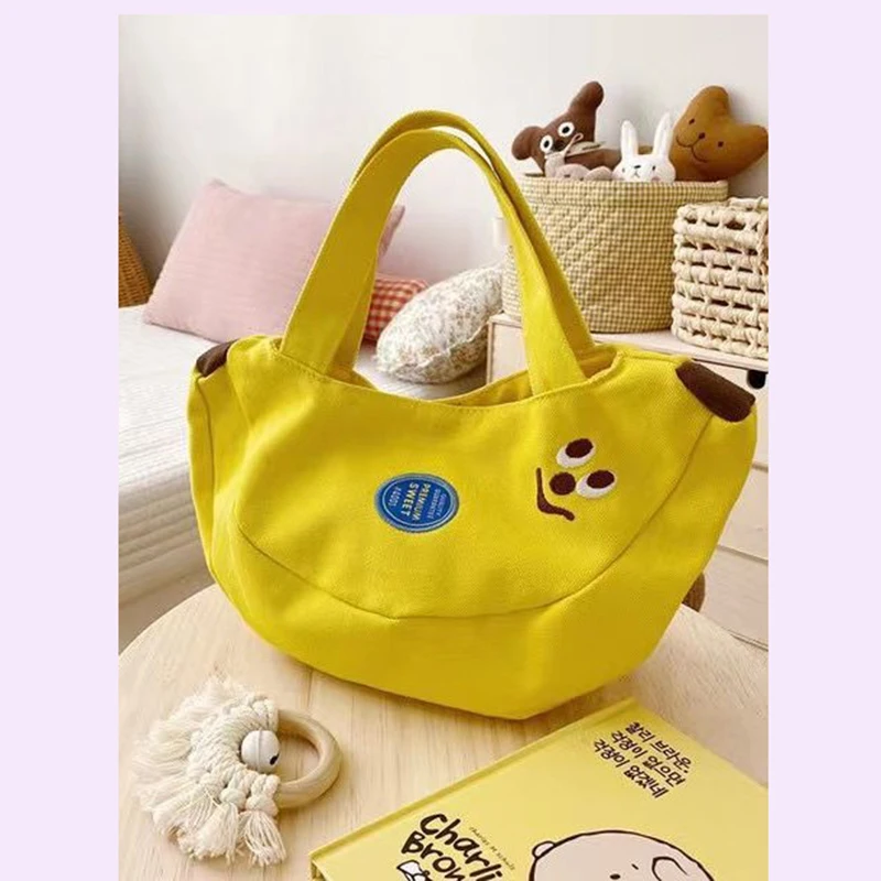 Cute and innovative banana bag with cartoon embroidery canvas bag for office workers convenient handbag for moms to carry when
Cute and innovative banana bag with cartoon embroidery canvas bag for office workers convenient handbag for moms to carry when
