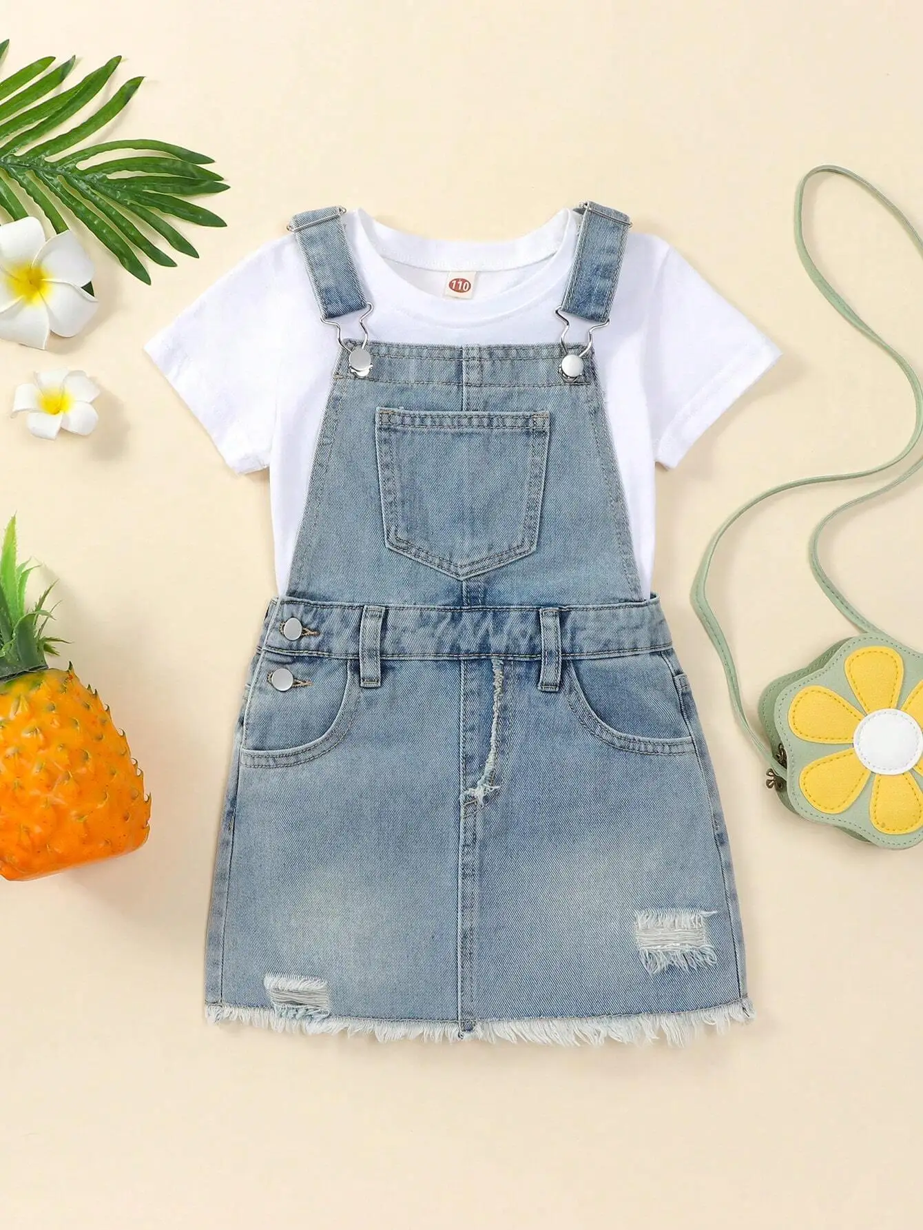 Girls Light Washed Denim Overall Dress with Ripped Detail and Raw Hem
Girls Light Washed Denim Overall Dress with Ripped Detail and Raw Hem