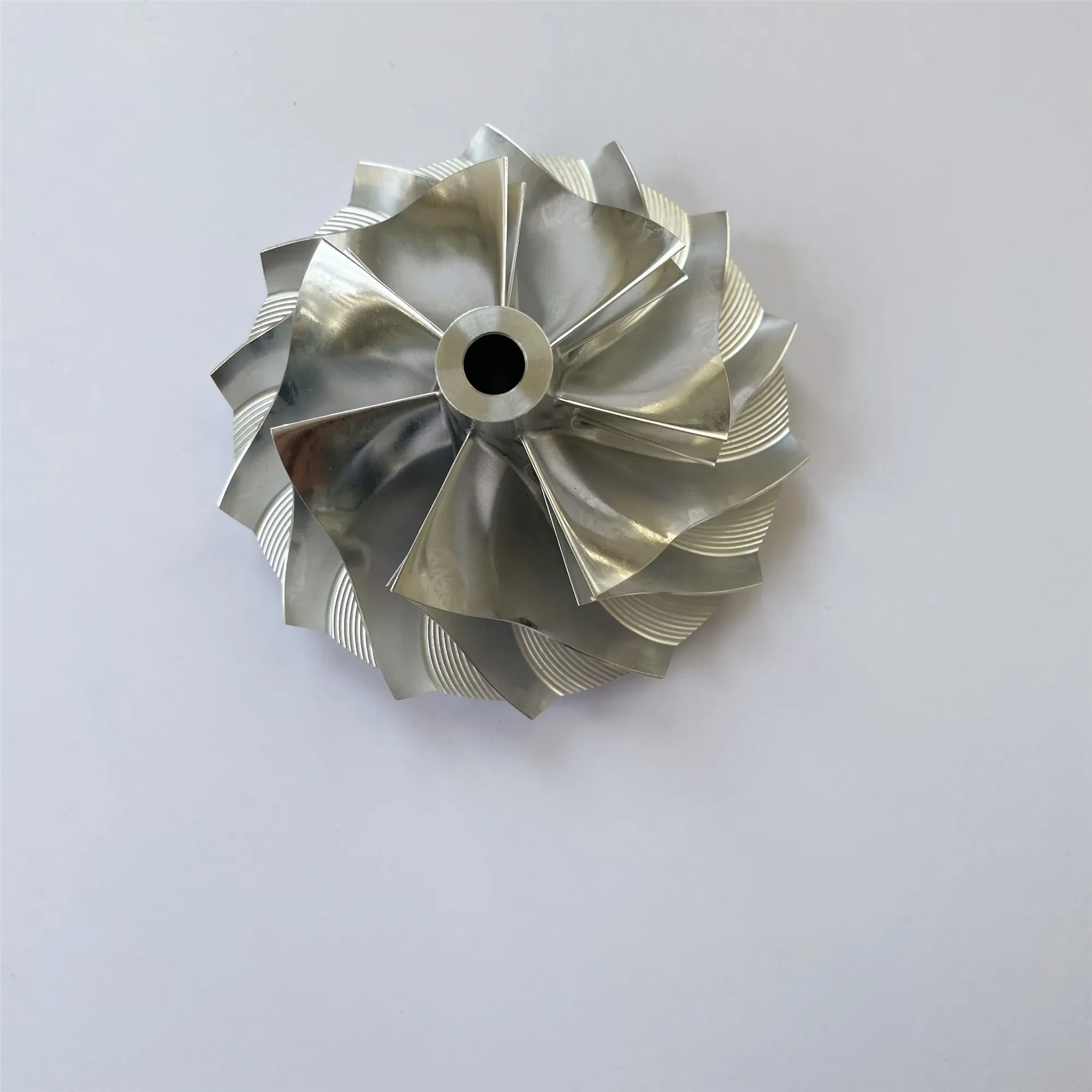 K26 56.85/79.00mm 7+7 blades Turbo milling/aluminum 2618/billet compressor wheel
K26 56.85/79.00mm 7+7 blades Turbo milling/aluminum 2618/billet compressor wheel