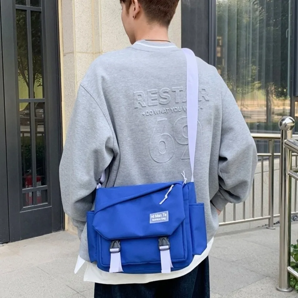 Large Capacity Nylon Messenger Bag Multi Pocket Korean Style Crossbody Bag Solid Color Flip Cover Mailman Bag Back To School 
Large Capacity Nylon Messenger Bag Multi Pocket Korean Style Crossbody Bag Solid Color Flip Cover Mailman Bag Back To School