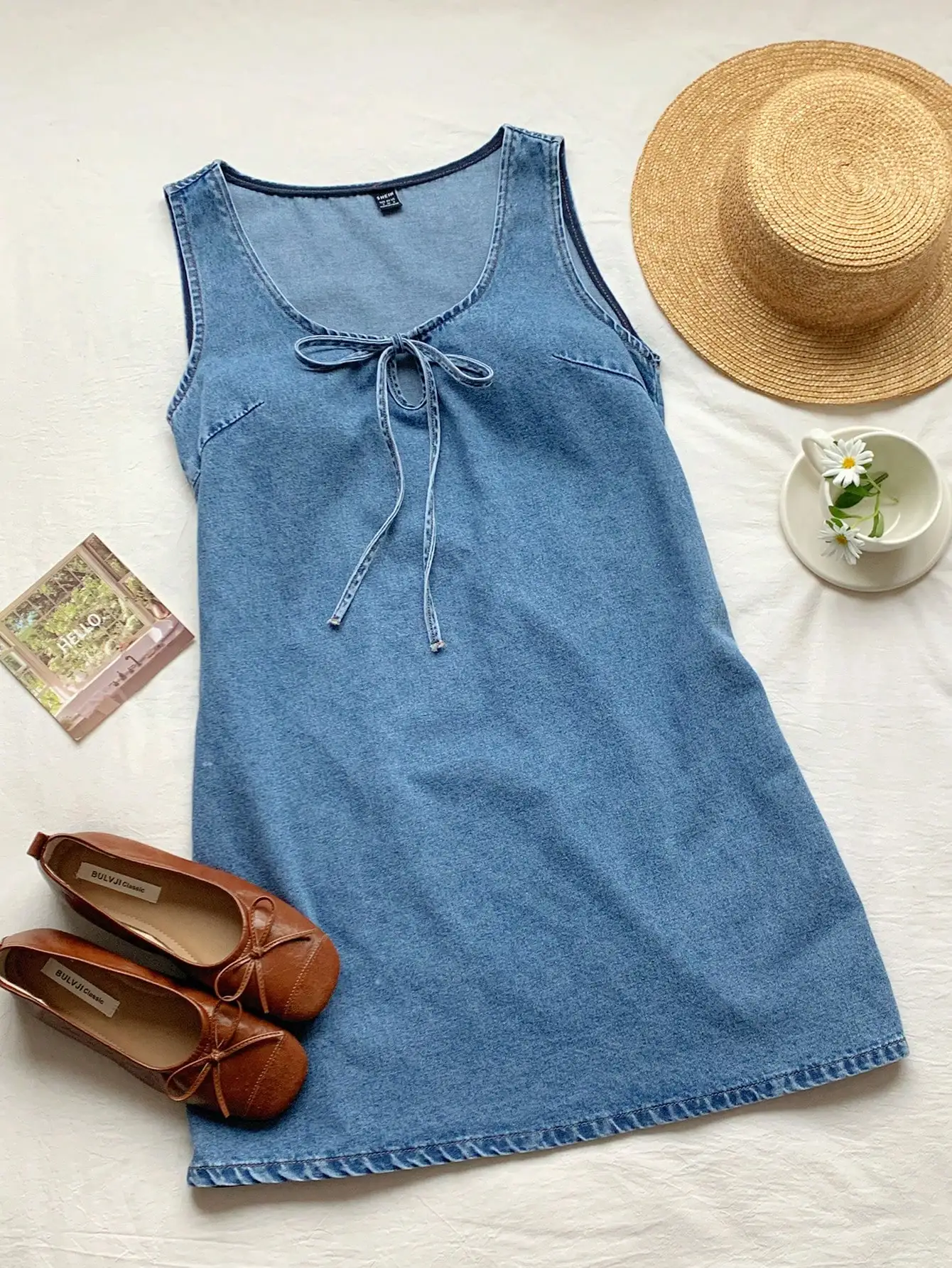 Light Blue Denim Sleeveless Mini Dress With Adjustable Front Tie, Relaxed Fit For Summer Beach, Vacation, And Casual Outings
Light Blue Denim Sleeveless Mini Dress With Adjustable Front Tie, Relaxed Fit For Summer Beach, Vacation, And Casual Outings